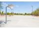 Outdoor basketball court with multiple hoops and plenty of space for play at 3605 W Pecos Rd, Chandler, AZ 85226