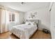 Bright bedroom with a large bed, decorative wall art, and natural light from the window at 3605 W Pecos Rd, Chandler, AZ 85226