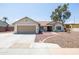 Charming single-story home featuring a well-manicured front yard and a neutral-colored exterior, including a two-car garage at 3605 W Pecos Rd, Chandler, AZ 85226