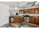 Functional kitchen featuring tile floors, plenty of cabinet space, and stainless steel appliances at 3605 W Pecos Rd, Chandler, AZ 85226