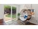 A sun room featuring a hanging chair and a view of the backyard at 3605 W Pecos Rd, Chandler, AZ 85226