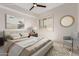 Comfortable bedroom featuring a plush bed, neutral decor, and a window with shutters at 36600 N Cave Creek Rd # C7, Cave Creek, AZ 85331