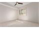 Bedroom featuring neutral carpet, ceiling fan, and plantation shutters at 36600 N Cave Creek Rd # C7, Cave Creek, AZ 85331