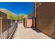 Side view of a modern property highlighting a private gated entrance at 36600 N Cave Creek Rd # C7, Cave Creek, AZ 85331