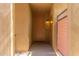 View of the front door with a private entry and a lovely light fixture at 36600 N Cave Creek Rd # C7, Cave Creek, AZ 85331