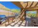 Outdoor grill and dining area featuring a built-in grill, prep area, seating, and desert views at 36600 N Cave Creek Rd # C7, Cave Creek, AZ 85331