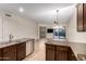 Well-lit kitchen featuring dark wood cabinets and a large island counter at 36600 N Cave Creek Rd # C7, Cave Creek, AZ 85331