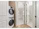Hallway view of stackable washer and dryer opposite bedroom entrance at 36600 N Cave Creek Rd # C7, Cave Creek, AZ 85331