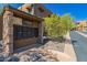 View of the community mailboxes nestled in a stone and stucco structure under the clear blue sky at 36600 N Cave Creek Rd # C7, Cave Creek, AZ 85331