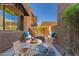 Charming courtyard patio with inviting seating area and a cozy fire pit at 36600 N Cave Creek Rd # C7, Cave Creek, AZ 85331