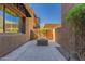 Private rear patio has a fire pit and is surrounded by vegetation at 36600 N Cave Creek Rd # C7, Cave Creek, AZ 85331