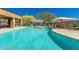 Community pool with ample seating, shade, mountain views, and sparkling blue water at 36600 N Cave Creek Rd # C7, Cave Creek, AZ 85331