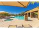 Resort-style pool featuring lounge chairs, hot tub and umbrellas for relaxing by the water at 36600 N Cave Creek Rd # C7, Cave Creek, AZ 85331