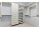 Walk-in closet with custom built-ins and multiple shelves for ample storage at 36600 N Cave Creek Rd # C7, Cave Creek, AZ 85331
