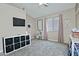 Bright bedroom offering a ceiling fan, neutral walls, and a large window at 3812 W Carlos Ln, San Tan Valley, AZ 85144