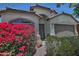 Charming single-Gathering home with well-maintained landscaping, colorful flowers, and a welcoming front entrance at 3812 W Carlos Ln, San Tan Valley, AZ 85144