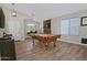 Spacious game room with a pool table, dart board, and stylish wood-look tile flooring at 3812 W Carlos Ln, San Tan Valley, AZ 85144