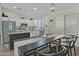 Bright kitchen featuring white cabinetry, granite countertops, and stainless steel appliances, perfect for culinary enthusiasts at 3812 W Carlos Ln, San Tan Valley, AZ 85144