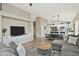 Open-concept design seamlessly connects the living, dining, and kitchen areas, perfect for modern living and entertaining at 3812 W Carlos Ln, San Tan Valley, AZ 85144