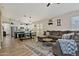 Inviting open-concept living space featuring modern decor, wood floors, and abundant natural light at 3812 W Carlos Ln, San Tan Valley, AZ 85144