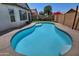 Sparkling blue pool is a refreshing focal point in this beautifully landscaped backyard retreat, ideal for recreation at 3812 W Carlos Ln, San Tan Valley, AZ 85144