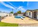 Private backyard oasis with a refreshing pool and lush landscaping, creating an ideal spot for unwinding and hosting guests at 4028 W El Camino Dr, Phoenix, AZ 85051