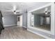 Spacious bonus room with large mirror, ceiling fan and tile flooring at 4028 W El Camino Dr, Phoenix, AZ 85051