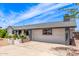 Charming single story home featuring beautiful landscaping and a spacious front yard, with a large driveway at 4028 W El Camino Dr, Phoenix, AZ 85051