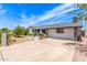 Charming single story home featuring beautiful landscaping and a spacious front yard, with a large driveway at 4028 W El Camino Dr, Phoenix, AZ 85051