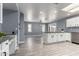 Bright eat-in kitchen features white cabinets, granite countertops and stainless steel appliances at 4028 W El Camino Dr, Phoenix, AZ 85051