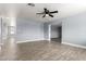 Spacious living room featuring tile flooring, ceiling fan and natural light at 4028 W El Camino Dr, Phoenix, AZ 85051
