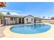 Backyard pool offers a serene escape with clear blue water, surrounded by lush greenery, ideal for summer enjoyment at 4028 W El Camino Dr, Phoenix, AZ 85051