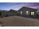 Spacious backyard with gravel landscaping and a brick-paver walkway at 4218 W Palace Station Rd, New River, AZ 85087