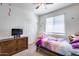 Cozy bedroom with neutral carpet, a ceiling fan, a double closet, and a playful, decorated theme at 4218 W Palace Station Rd, New River, AZ 85087