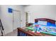 Bright bedroom with a cartoon-themed bedspread, closet, and an ensuite bathroom at 4218 W Palace Station Rd, New River, AZ 85087