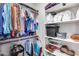 Organized walk-in closet with shelving, rods for hanging clothes, and plenty of storage space at 4218 W Palace Station Rd, New River, AZ 85087