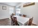 Dining room with wood floors, large table and sliding glass door to patio at 4218 W Palace Station Rd, New River, AZ 85087