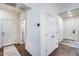 Hallway showcasing multiple doors and hardwood style flooring at 4218 W Palace Station Rd, New River, AZ 85087