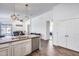 Modern kitchen featuring stainless steel appliances, wood-look flooring and an open view to the dining room at 4218 W Palace Station Rd, New River, AZ 85087