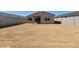 View of the backyard featuring a dirt lot and block wall fencing at 4256 W Lisa Ln, San Tan Valley, AZ 85144