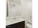 Well-lit bathroom features a white vanity top and a shower-tub combination at 4256 W Lisa Ln, San Tan Valley, AZ 85144