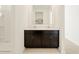 Bathroom vanity with dual sinks, dark cabinets, and tiled floor at 4256 W Lisa Ln, San Tan Valley, AZ 85144