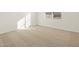 Bright, carpeted bedroom with sunlit windows and ample space at 4256 W Lisa Ln, San Tan Valley, AZ 85144