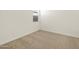 This carpeted bedroom features a window for natural lighting and electrical outlets at 4256 W Lisa Ln, San Tan Valley, AZ 85144