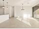 Dining room has tiled floors, modern chandelier and sliding doors leading to a patio at 4256 W Lisa Ln, San Tan Valley, AZ 85144