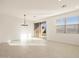 Bright dining area with modern chandelier, sliding doors, and a window at 4256 W Lisa Ln, San Tan Valley, AZ 85144