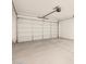 Spacious two car garage with concrete floor and automatic door opener at 4256 W Lisa Ln, San Tan Valley, AZ 85144