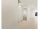 Bright hallway with tile flooring, recessed lighting, and white doors leading to various rooms at 4256 W Lisa Ln, San Tan Valley, AZ 85144