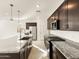 Spacious kitchen features stainless steel appliances, granite countertops, and a large center island at 4256 W Lisa Ln, San Tan Valley, AZ 85144