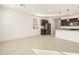 Open floor plan of a kitchen that features stainless steel appliances, a kitchen island, and great natural light at 4256 W Lisa Ln, San Tan Valley, AZ 85144